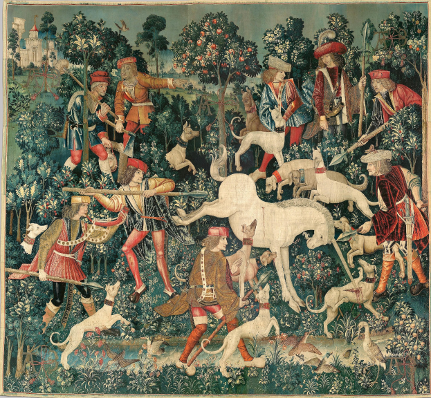 Ein mittelalterliches Wandteppichbild, das Menschen in historischer Kleidung bei der Jagd in einer üppigen Landschaft mit Tieren, Bäumen, Blumen, Vögeln und einer fernen Burg zeigt.