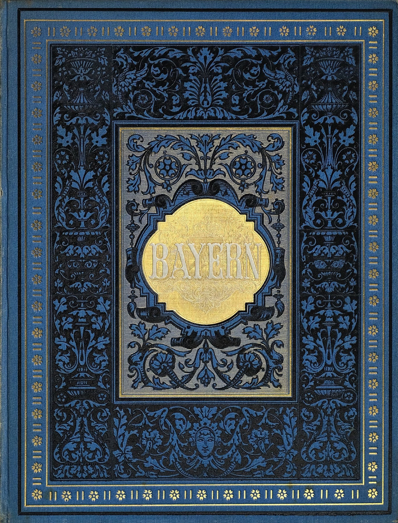 Ein blau-goldenes Buch mit der Aufschrift "Bayern" und verzierten Designs